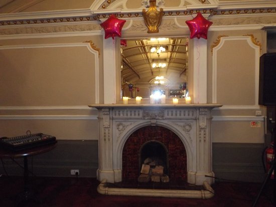 The candlelit fireplace and mirror Picture of Sloans Bar the candlelit fireplace