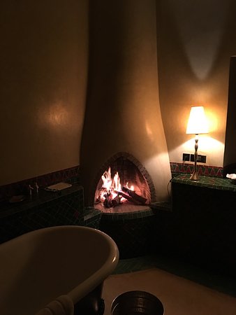 Fireplace in the bathroom in front of a huge tub fireplace in the bathroom
