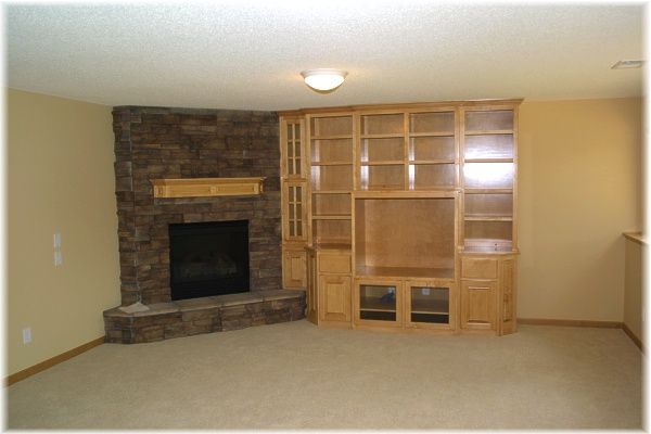 Cabinets Next to Fireplace Beautiful Corner Gas Stone Fireplace and Custom Maple Cabinetry In