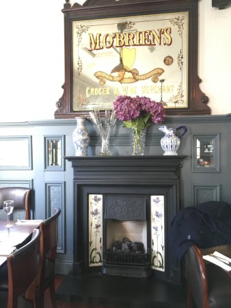 Tap water served in a classic looking bottle Picture of the fireplace at the