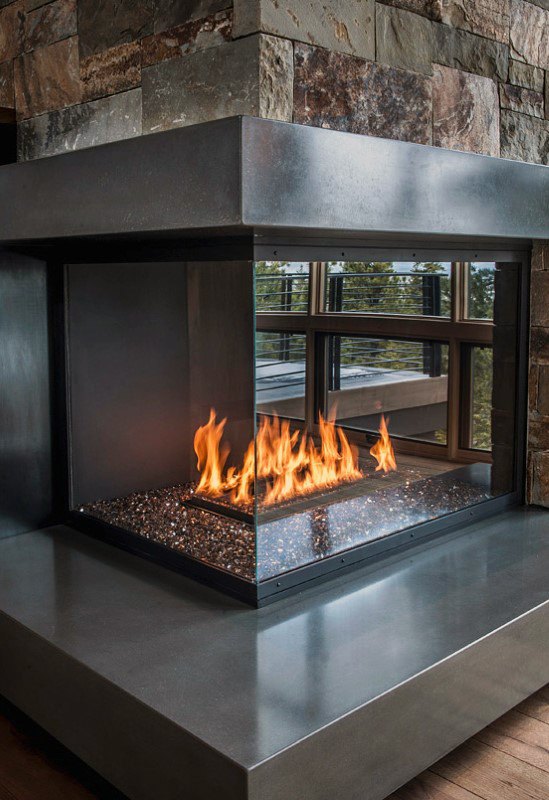 modern polished concrete and glass corner fireplace design