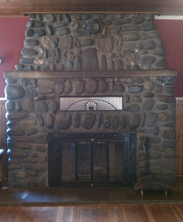 River rock fireplace in the dining room Picture of IdleYld idleyld lodge