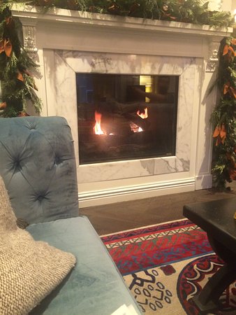 Fireplace in room with plementary tea coffee hot cocoa in wine hour in evening