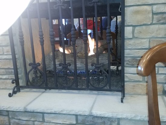 Cute little fireplace in center of seating Picture of la cute little fireplace