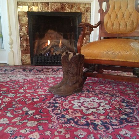 Guest boots near the crackling fireplace of the Washington guest boots near the