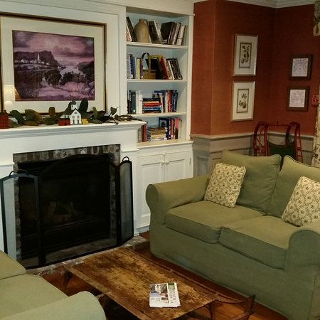 A fireplace lounge library area Picture of Chase House at library area