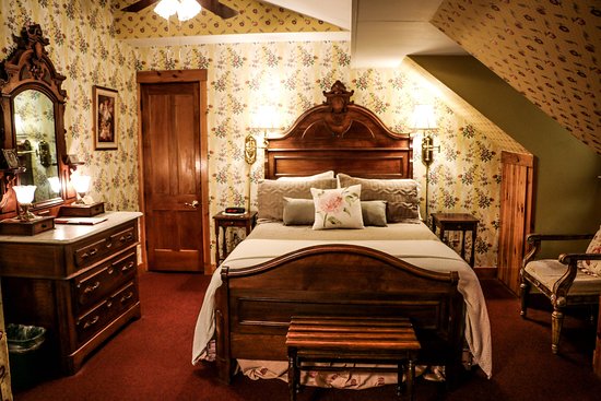A cozy room with a fireplace and a jetted tub it is called a cozy room with a fireplace