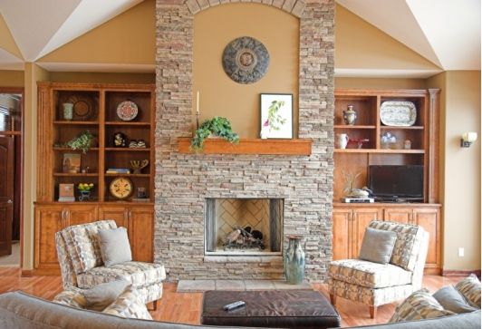 Classic stone fireplace with wooden accents 120d399ae965c1494f0f75f0f8078c1b