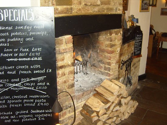 A log fire blazing in the grate wel es regulars and casual a log fire blazing in