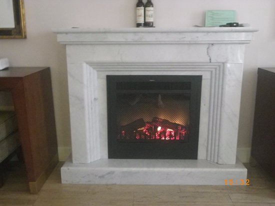 Marble fireplace and fire in bedroom Picture of Dalat marble fireplace and