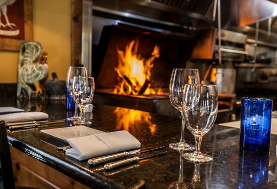 Guests can eat fireside by the grill and watch our chef s guests can eat fireside