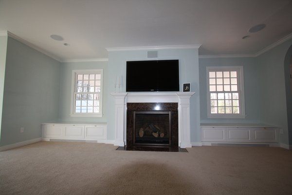 Family room interior with flat screened TV surround sound 480da9da ebded1bfb16ddcfd3