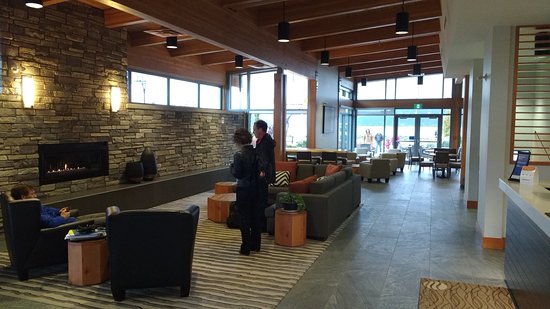 foyer with a stone fireplace