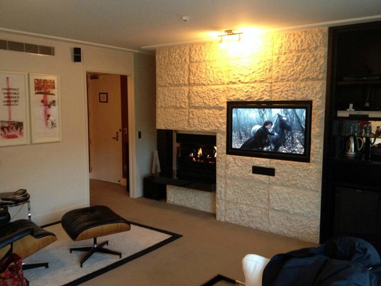 Lovely fireplace and TV sound system Picture of The Spire the spire queenstown