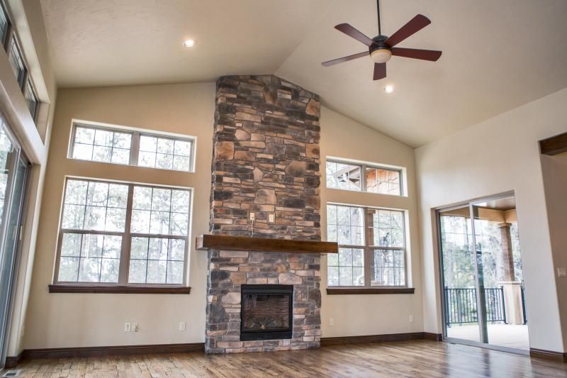 Living room with floor to ceiling stone fireplace Jayden 860d5cbe290d9a e60adffb