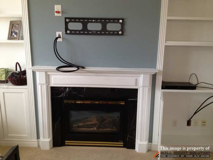 hide tv cords over fireplace