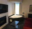 Hotel with Fireplace and Jacuzzi In Room Luxury Fireplace Jacuzzi Tub with Large Couch and Coffee Table