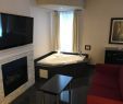 Hotel with Fireplace and Jacuzzi In Room Luxury Fireplace Jacuzzi Tub with Large Couch and Coffee Table