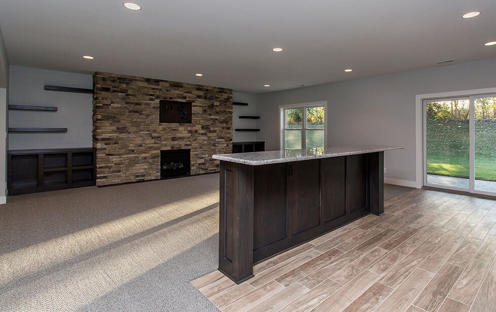 Dynasty Partners Homes family room with large stone a90d328e708b b06bc2722c164