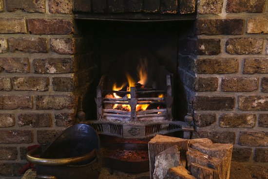 Open lit fire Picture of The Crown Newgate Street open lit fire