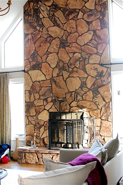 double story ugly stone fireplace