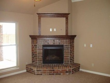 Raised Hearth Fireplace Fresh Add Wall Decorations to Update A Corner Fireplace In A Way