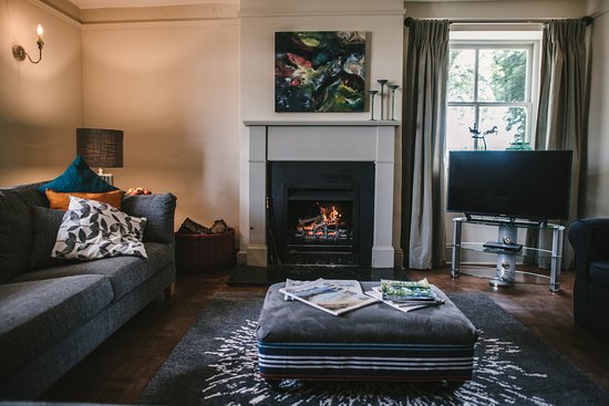 Family sitting room with open fire and 44" Smart TV family sitting room with