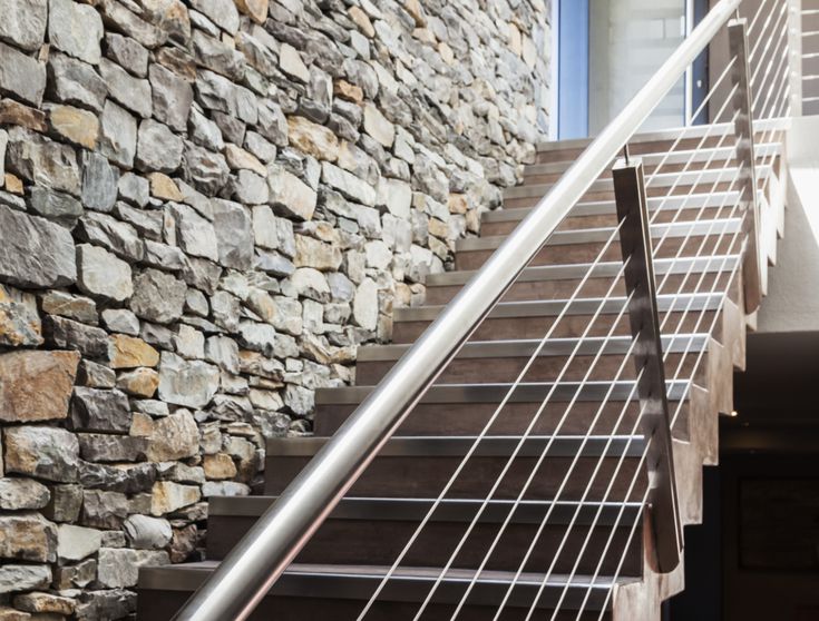 Veneer Stone vs Natural Stone Before Your Buy Stone Wall Next To Modern Staircase 56a49fd75f9b58b7d0d7e2b9