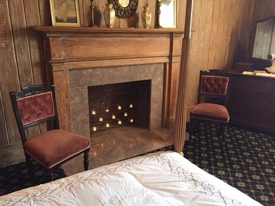 A beautiful old fireplace graces the Cole Porter Suite a beautiful old fireplace