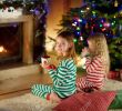 A Cozy Fireplace Luxury Two Cute Happy Girls Having Hot Chocolate by A Fireplace In A