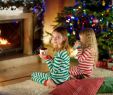 A Cozy Fireplace Luxury Two Cute Happy Girls Having Hot Chocolate by A Fireplace In A