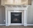 Artificial Fireplace New Cozy Up to This Fireplace Surrounded with White Subway Tile