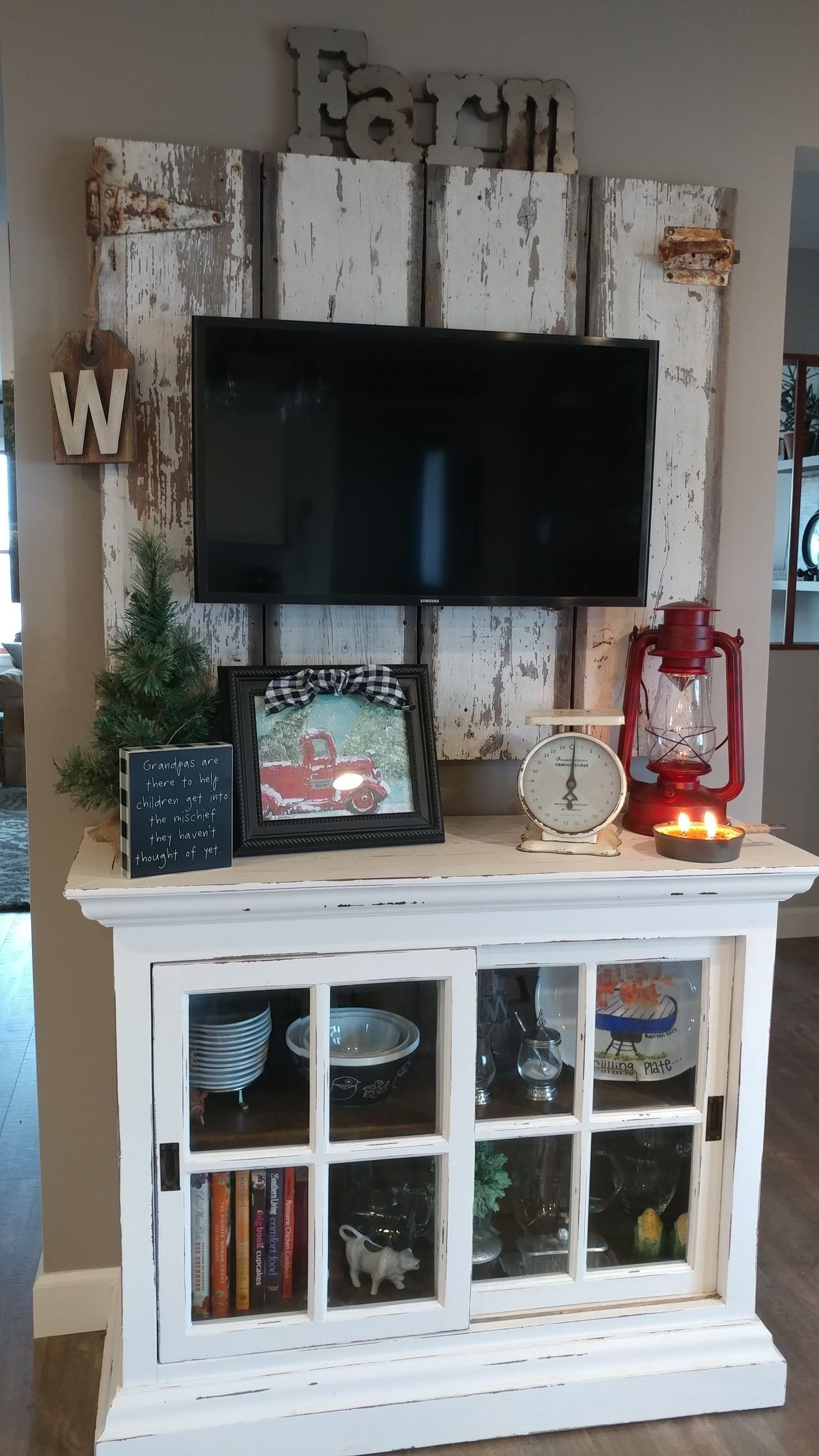 TV wall mounted on an old vintage barn door 0dd ca928afdc d e