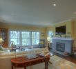 Cape Cod Fireplace Elegant Cape Cod Living Room with Beige Walls and Light Hardwood