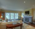 Cape Cod Fireplace Elegant Cape Cod Living Room with Beige Walls and Light Hardwood