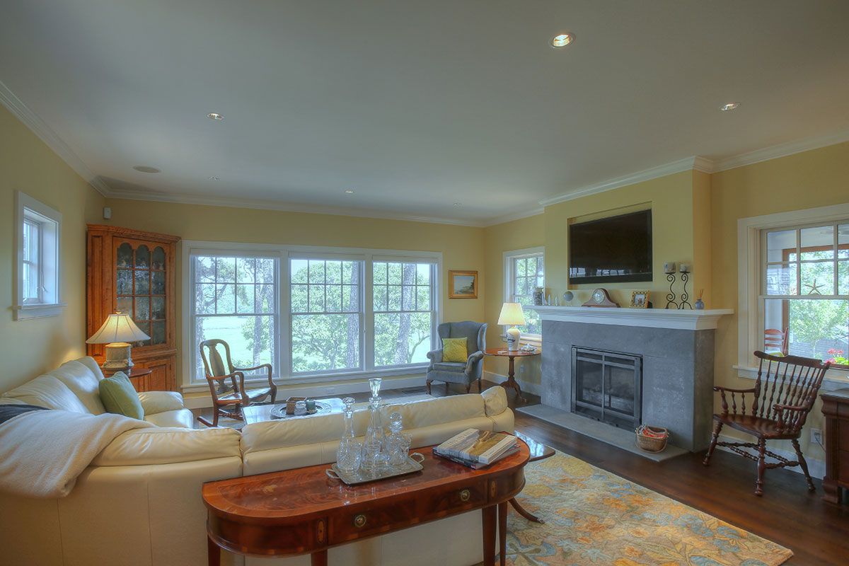 Cape Cod living room with beige walls and light hardwood 0d2a64f6ffda582a882ce7b889af7bd1