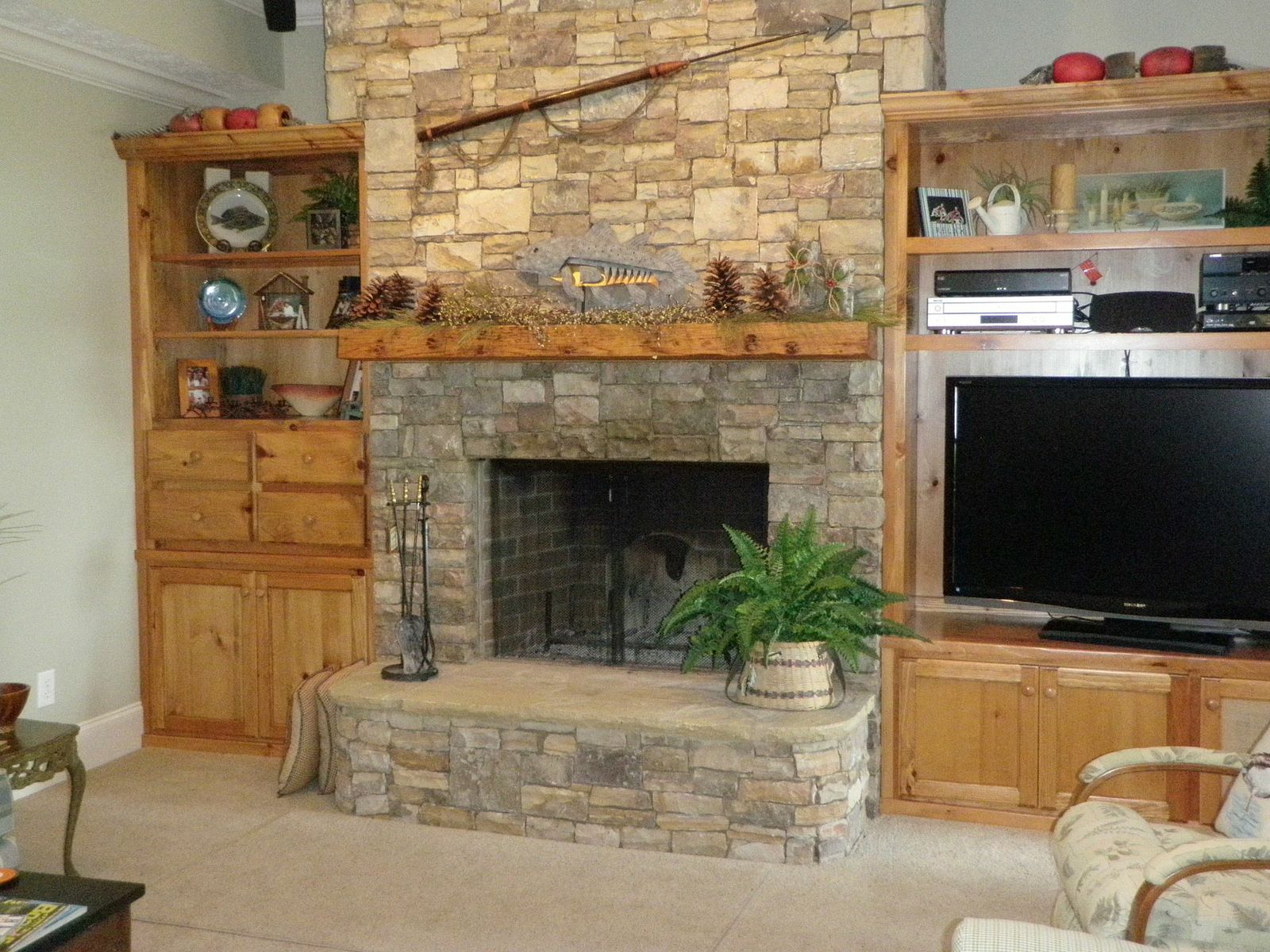 Interior Rustic Living Room Decoration With Shelves Unit rustic living room decoration with shelves unit and stone fireplace ideas plus wood fireplace mantle also armchair ideas boral stone fireplace stone mantelpiece feature wall ideas living room with fir