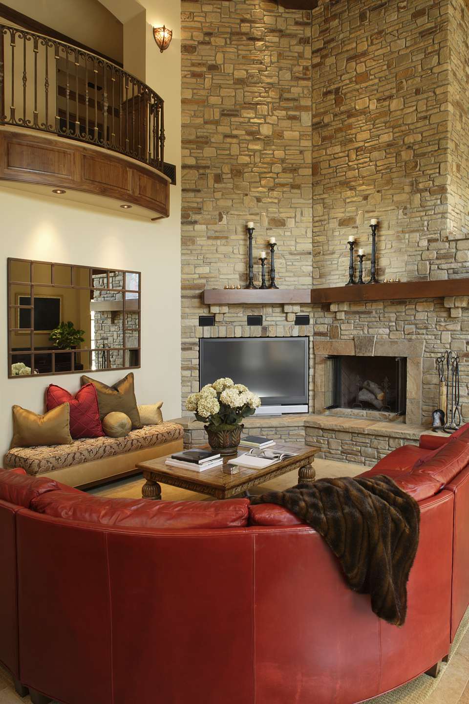 red leather sofa in living room with stone fireplace 582b f9b58d5b180b385
