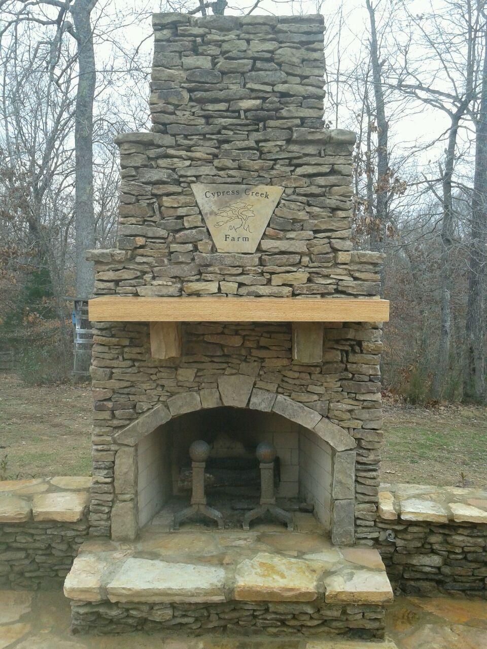 Fireplace Kit Elegant Fireplace with Cypress Wood Mantle and Custom Stone Plaque
