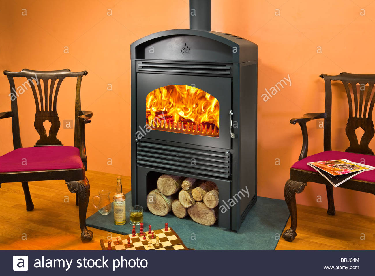 a woodfire c18 wood burning stove with log store below BRJ04M