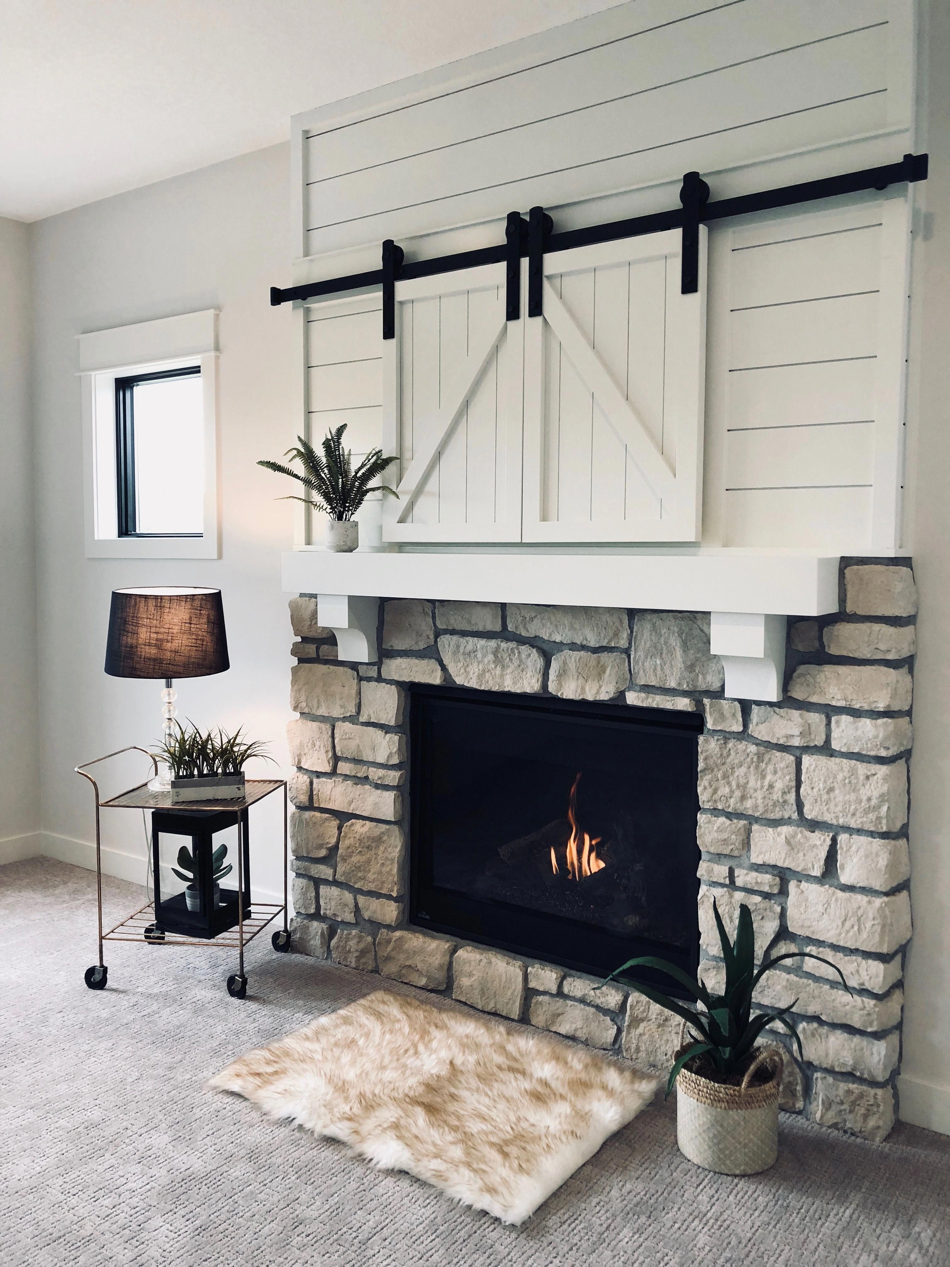 White painted shiplap on a fireplace with secret tv storage b10dd39d d107b5a9058ba9d82