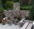 Flagstone Fireplace Luxury Outdoor Fireplace Incorporated Into High Stone Wall with