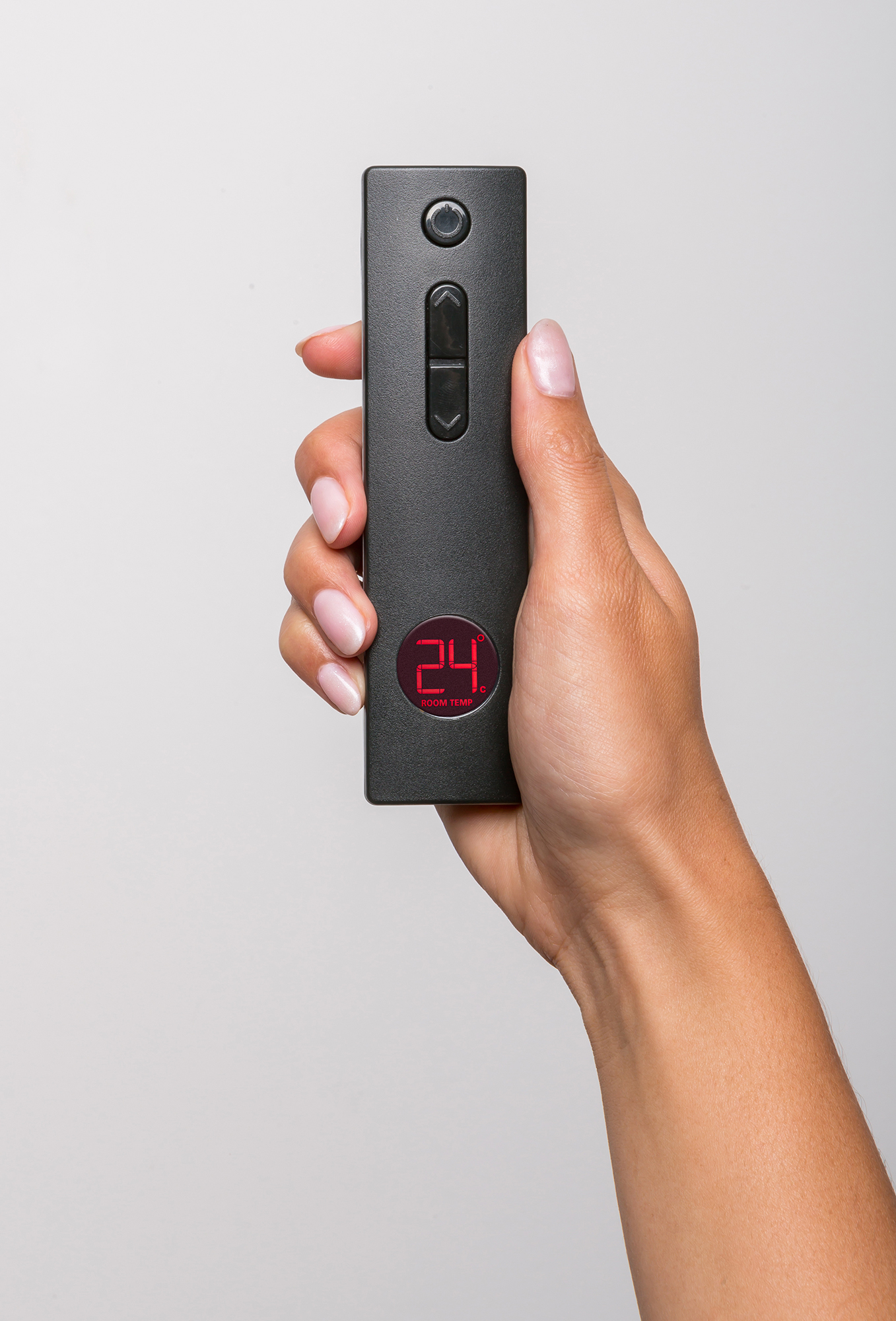 Rinnai Evolve 952 with simple remote universal controller in someones hand