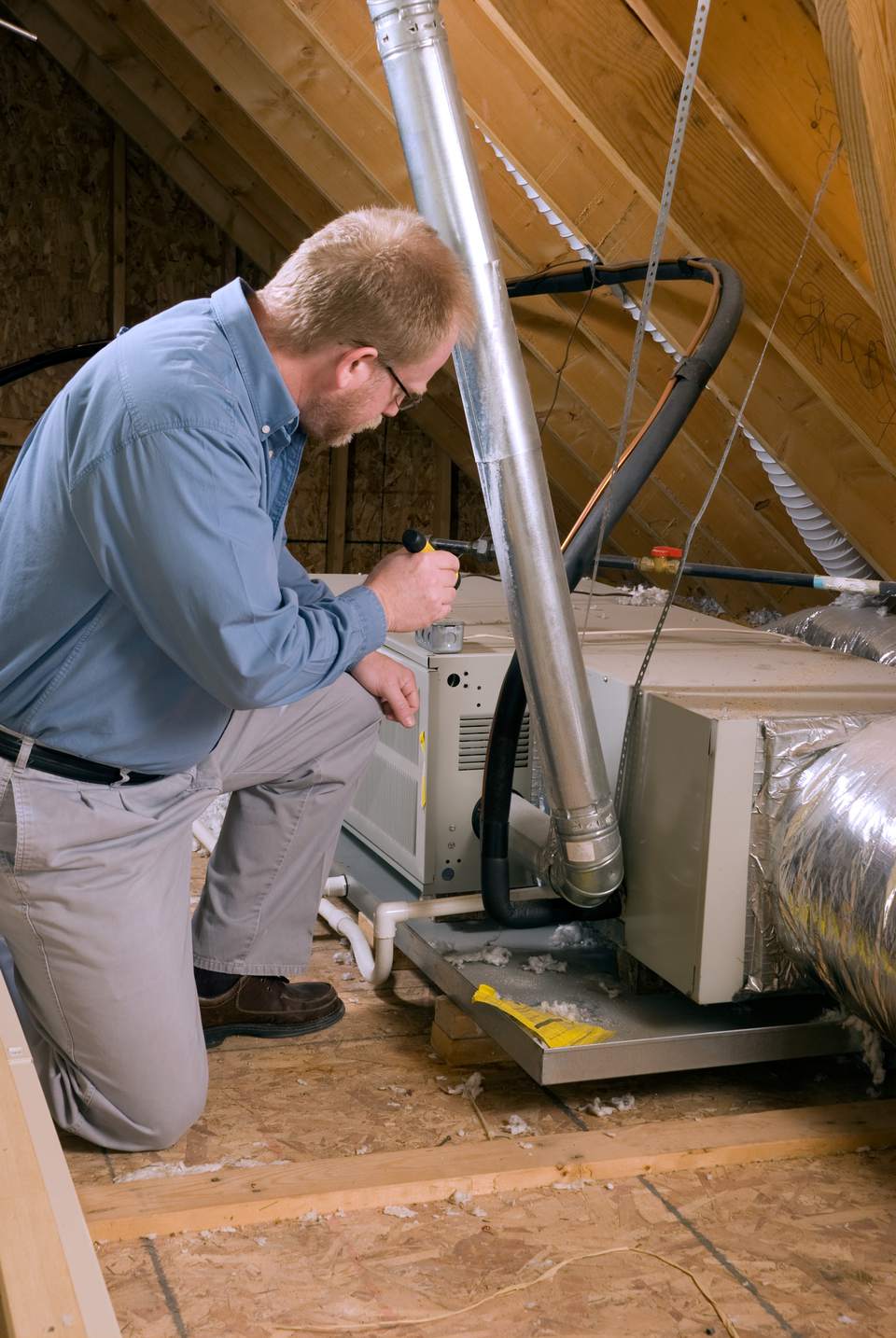 service man inspects furnace 584efb4d3df78c491e068f50