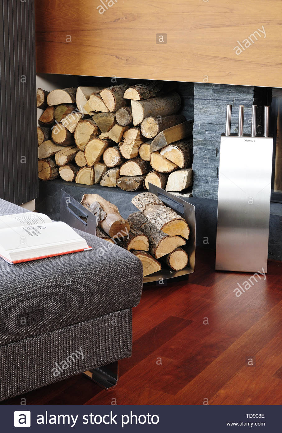 stainless steel log holder in front of matte granite wall fireplace uk irish use only TD908E