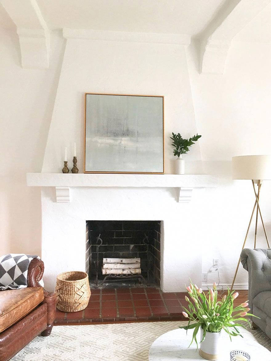 I love the all white fireplace The shape and how she has 0d3ee085d431bee9da8c2de12b6c2ff1