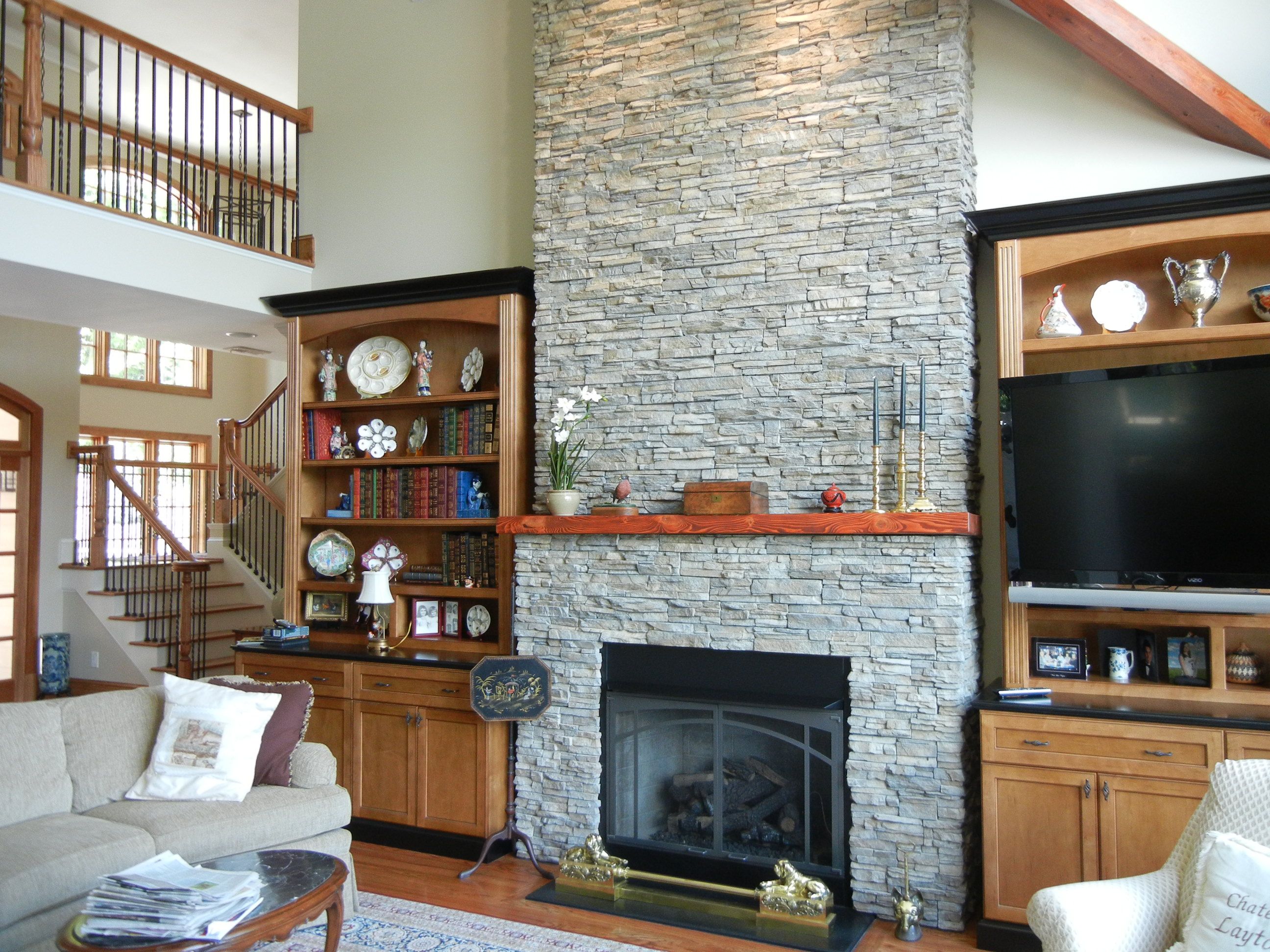 Stacked Rock Fireplace Unique Stone Fireplace Surrounded by Built In Bookshelves Creates A