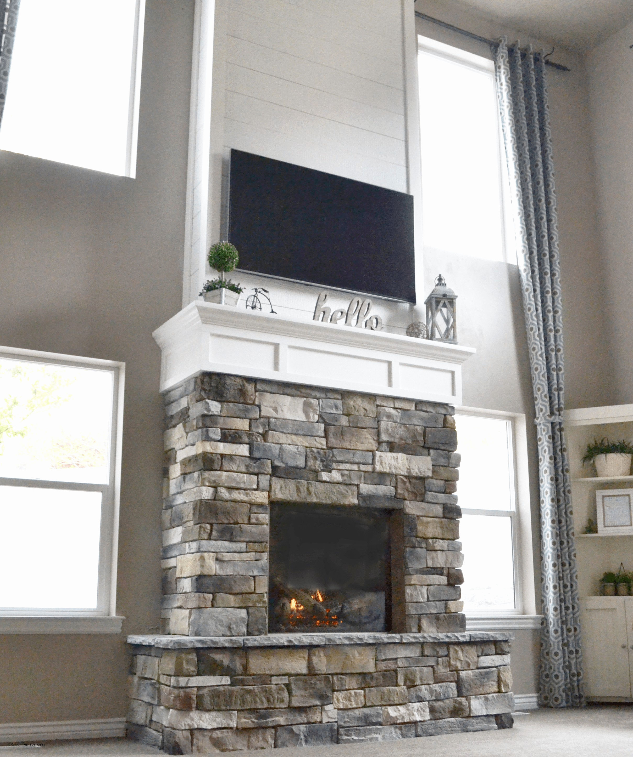 grommet curtain design with tv over fireplace and stone fireplace ideas also single hung windows plus shelves for modern living room decoration stone mantel ideas fireplace stone work ideas elegant fi