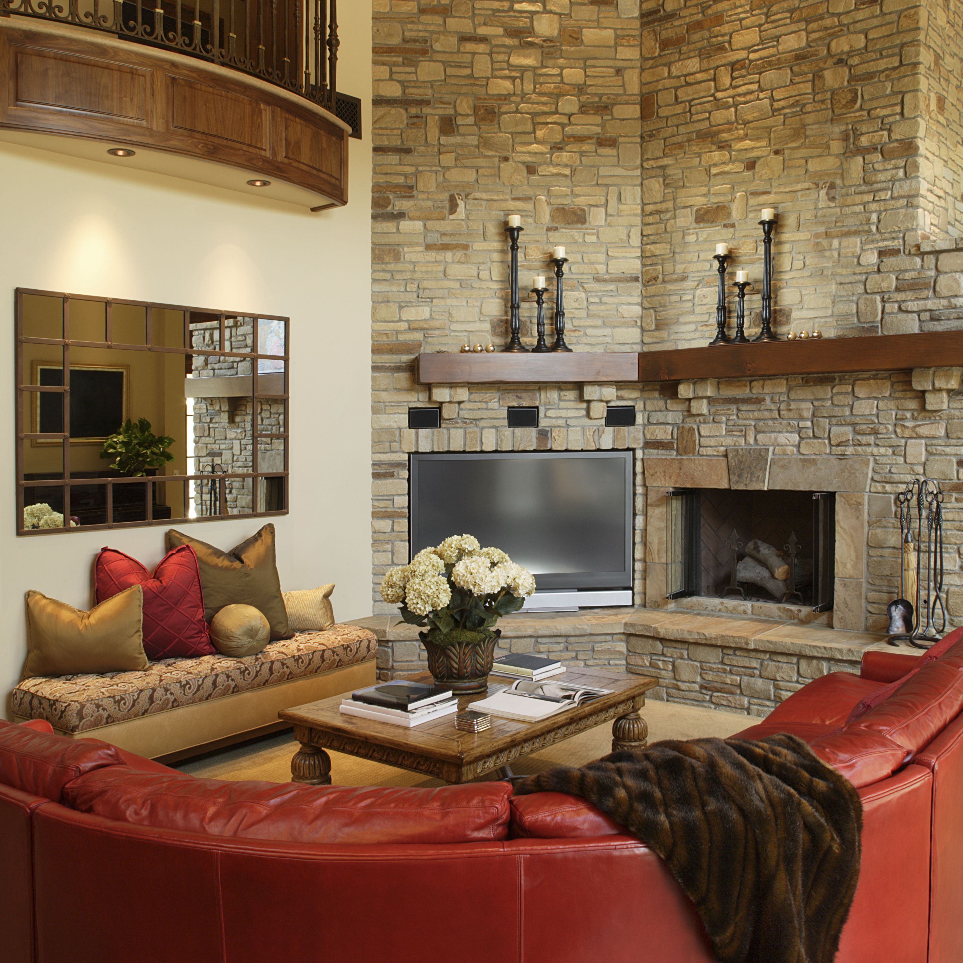 red leather sofa in living room with stone fireplace 582b f9b58d5b180b385