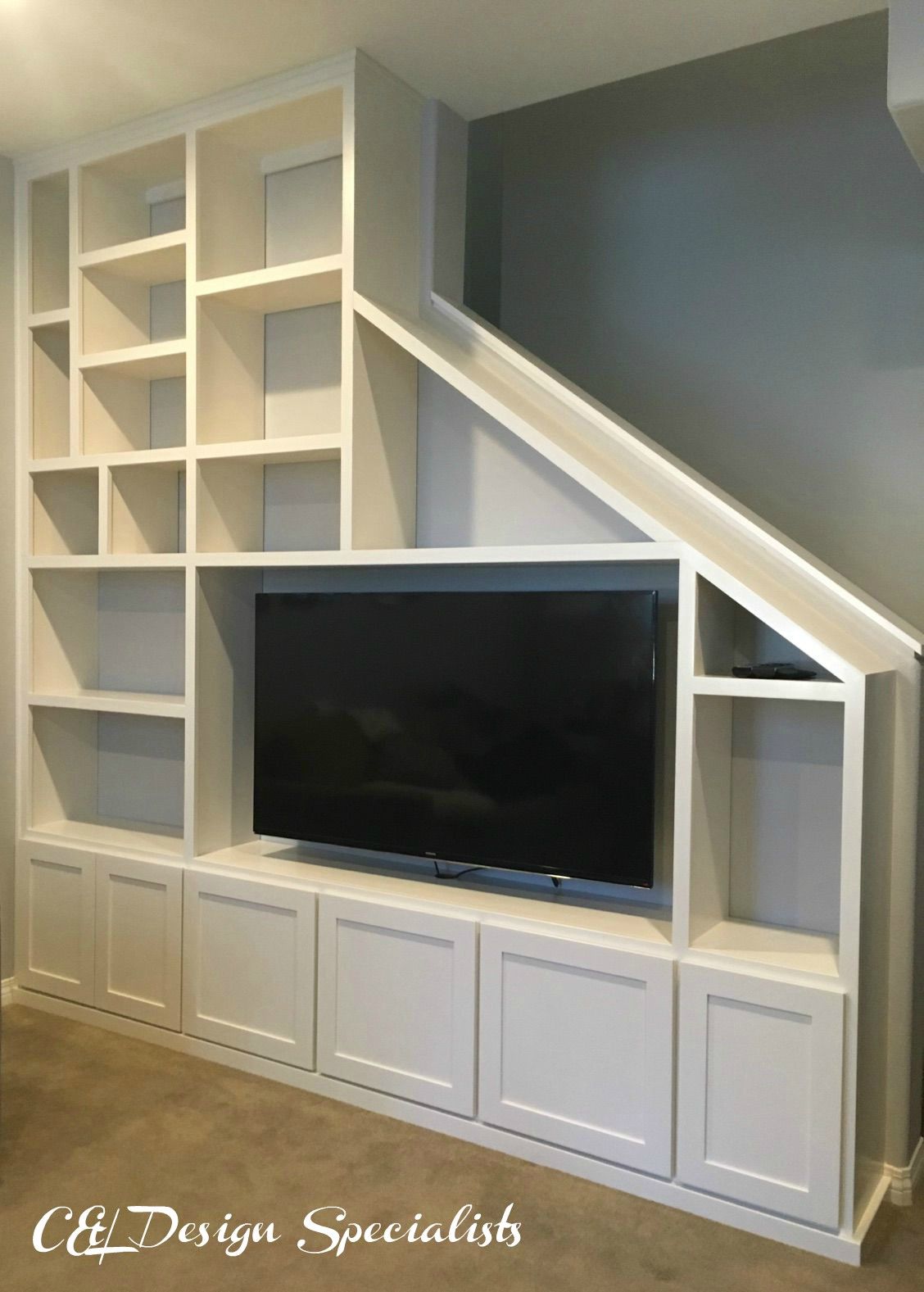 Entertainment Center designed to fit staircase wall 0d51df3f e9c0c1627e33c